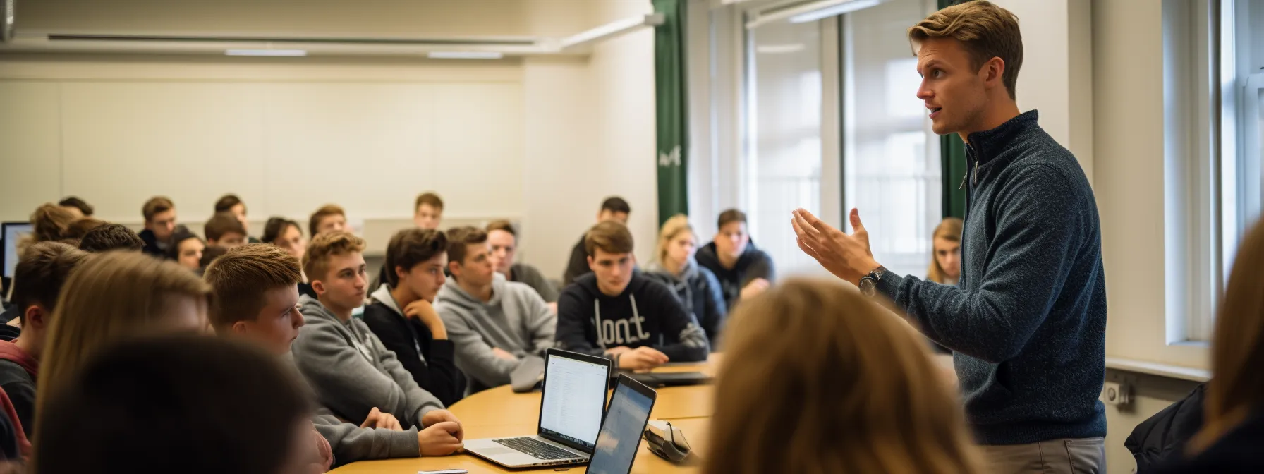 a group of students sitting in a classroom, attentively listening to a teacher explaining keyword research for seo.